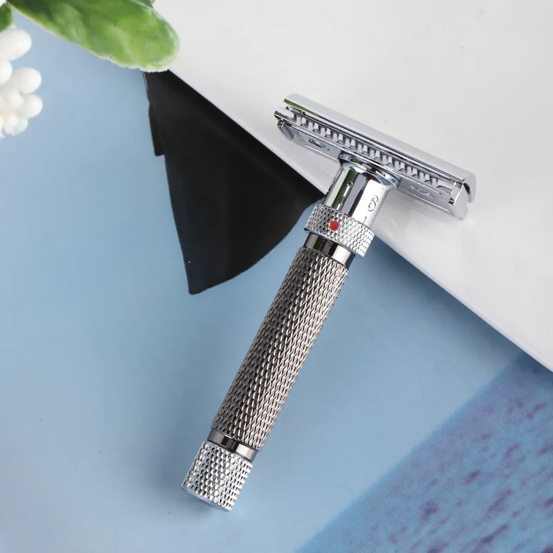 The Kelvedge razor resting on a bathroom surface beside folded cloth